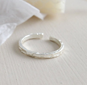 Irregular embossed fine ring